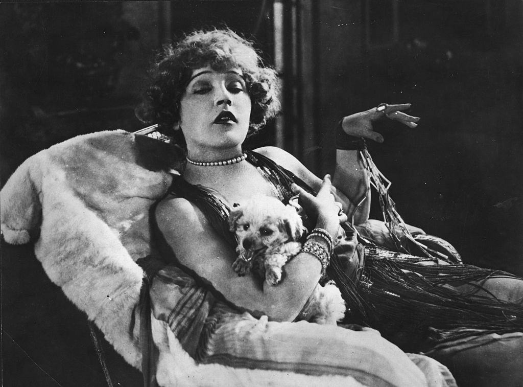 Mae Murray posing on the sofa, 1926.