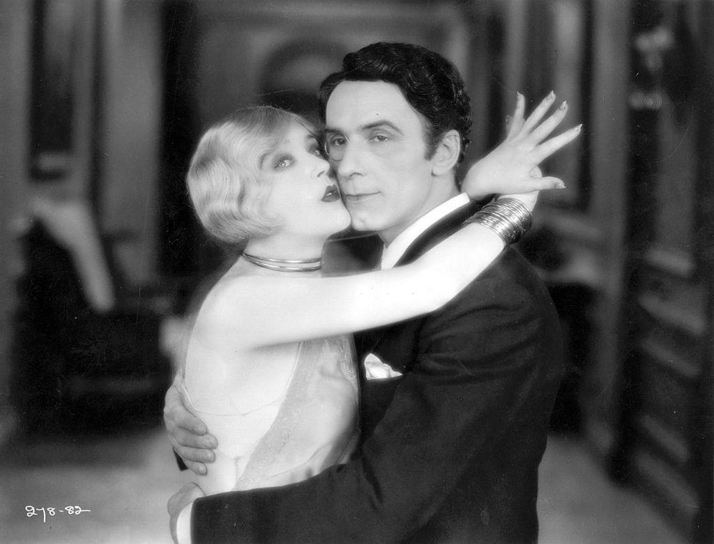 Mae Murray with George Andre Beranger in a scene from the film 'Altars Of Desire', 1927.