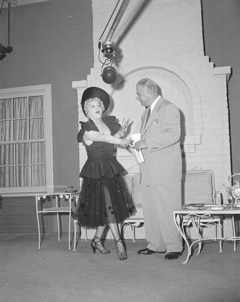 Mae Murray Conversing with Director Ralph Staub, 1950.