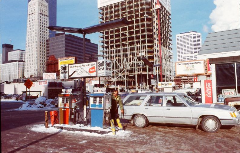 Old gas station at 3rd Avenue and 10th Street, Downtown Minneapolis. Piper Jaffray Tower under construction, 1983