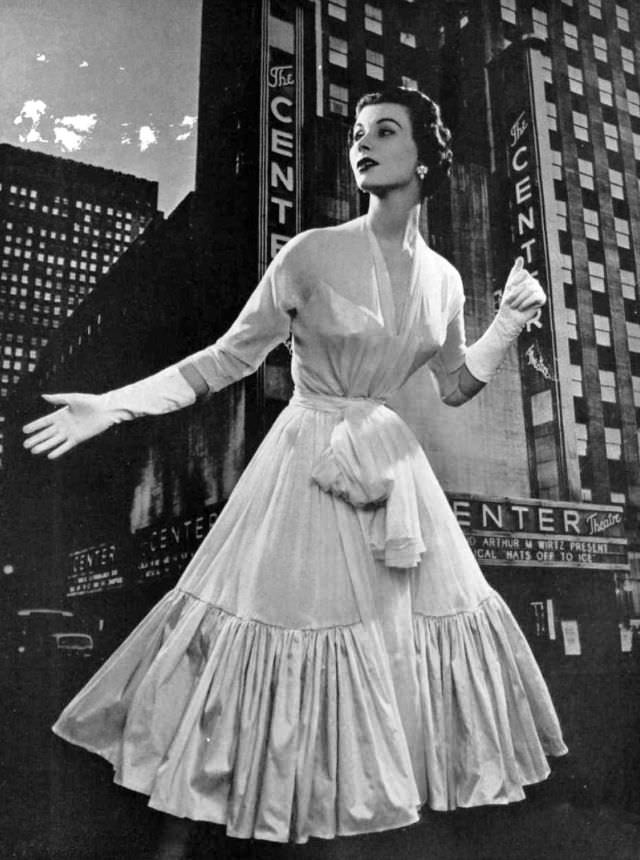 Myrtle Crawford in dress made for dancing, pale pink chiffon bordered by ruffle of pink taffeta, by Lanvin-Castillo, 1953