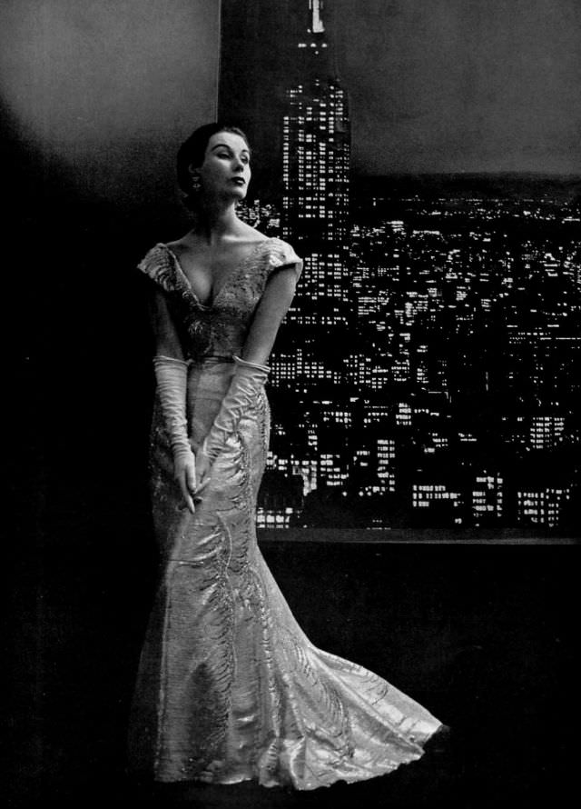 Myrtle Crawford in embroidered tulle gown with pointed v in front and back by Christian Dior, 1953