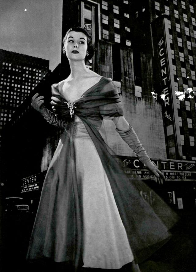 Myrtle Crawford in evening dress by Grès, brooch by Roger Scèmama, 1953