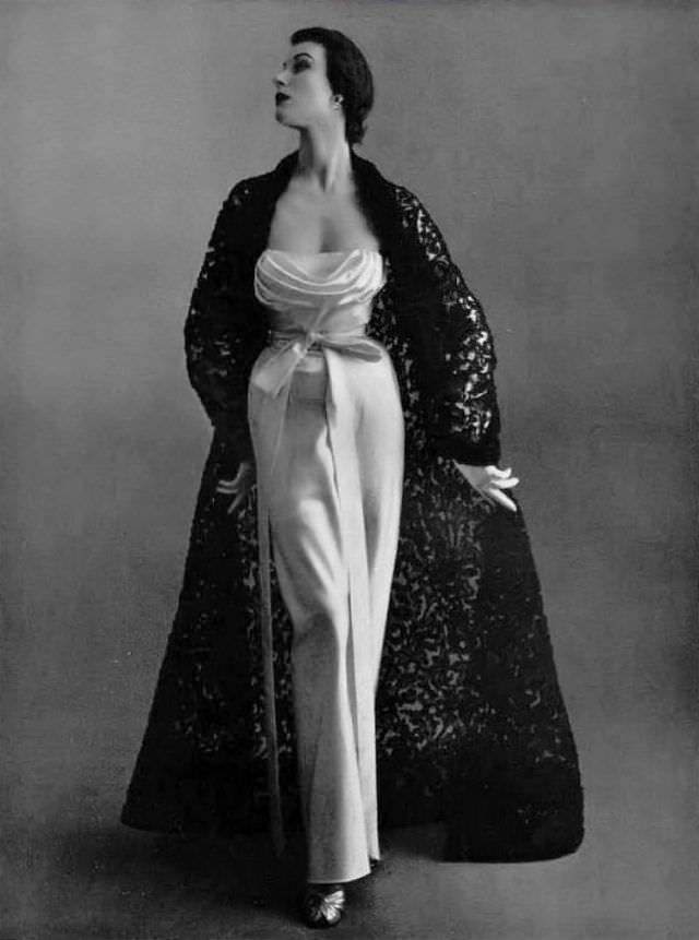 Myrtle Crawford in beautiful satin evening gown worn with a stunning black lace manteau by Givenchy, 1952