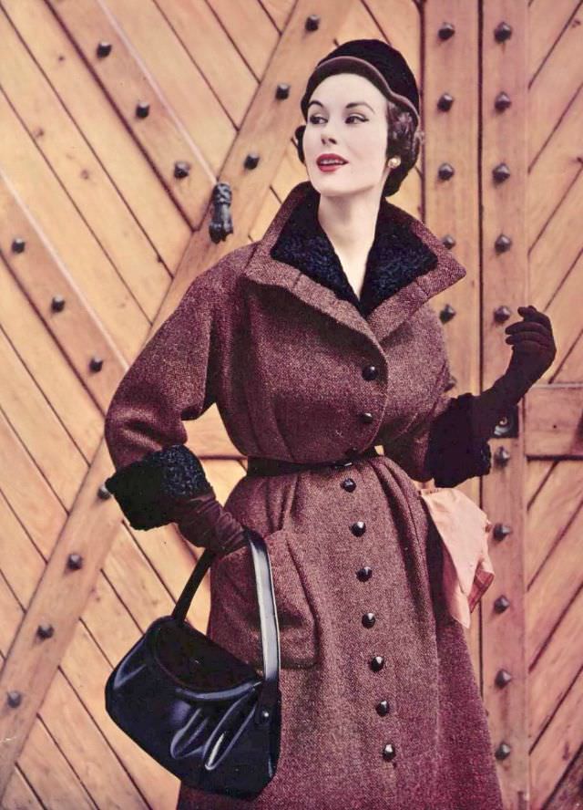 Myrtle Crawford in tweed coat with astrakhan collar and cuffs by Manguin, hat by Maud et Nano, handbag and gloves by Hermès, 1953