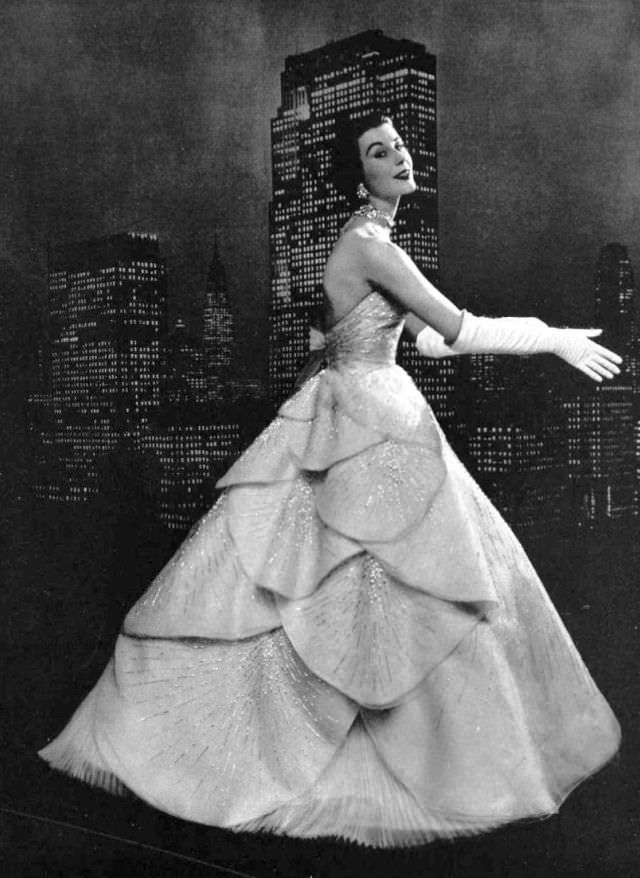 Myrtle Crawford in white organza evening gown entirely embroidered with silver sequins, 1953.