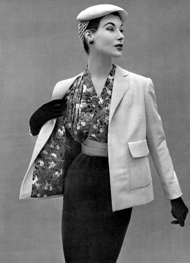 Myrtle Crawford is wearing a straight jacket of beige alpaca wool lined with silk floral print same as the blouse by Lanvin-Castillo, 1953