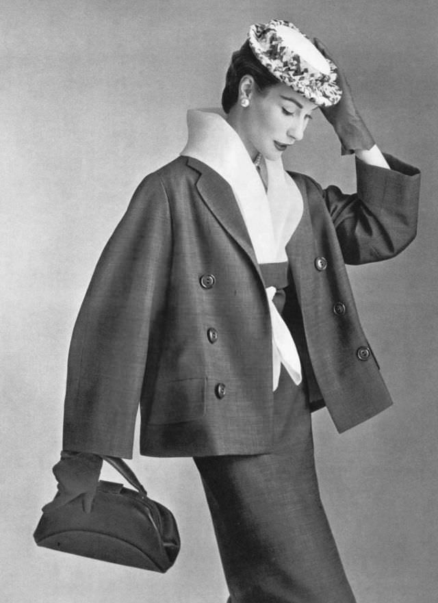 Myrtle Crawford in dress with white organdy fichu collar worn under roomy jacket, by Lanvin-Castillo, 1954