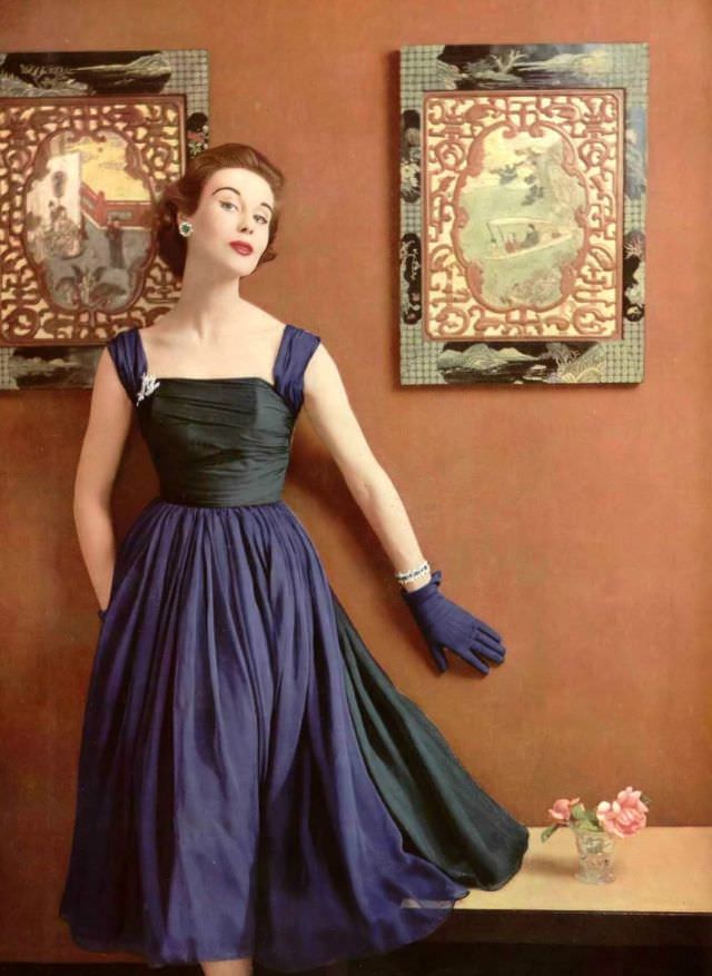 Myrtle Crawford in pretty chiffon dress in colors of stained glass by Lanvin-Castillo, jewelry by Roger Scémama, 1952