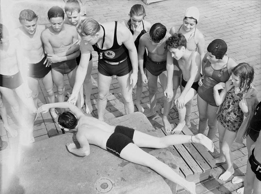 Children are pictured above learning to swim during a class session at the Astoria Pool in 1940. The city offered free swimming lessons to those who swam at the public pools.