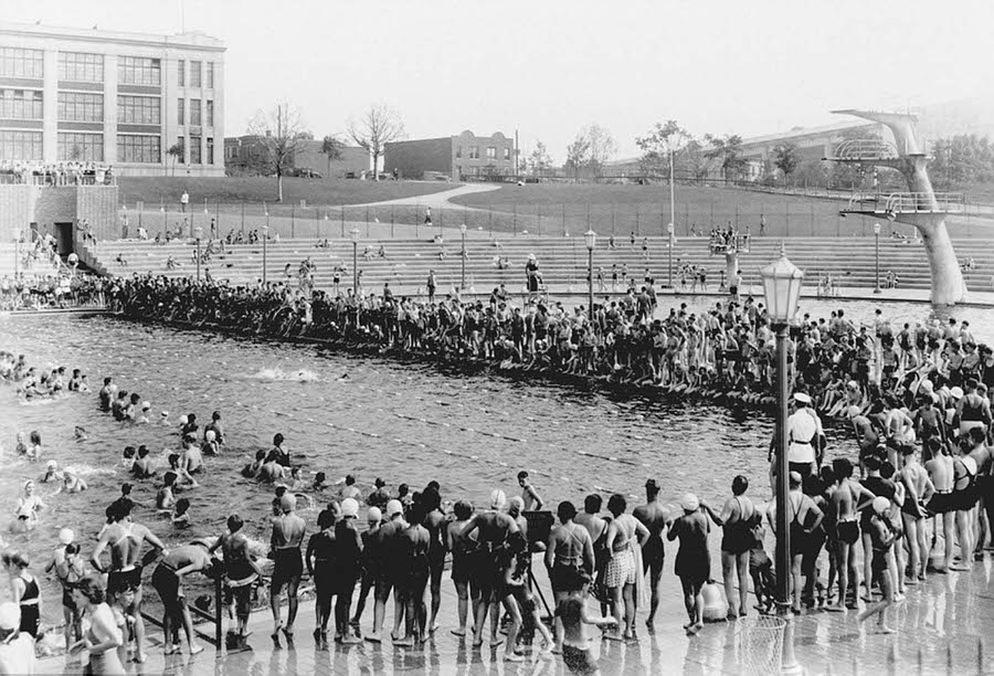 Dozens of New Yorkers gather around the Astoria pool on August 20, 1936, during a swim competition.