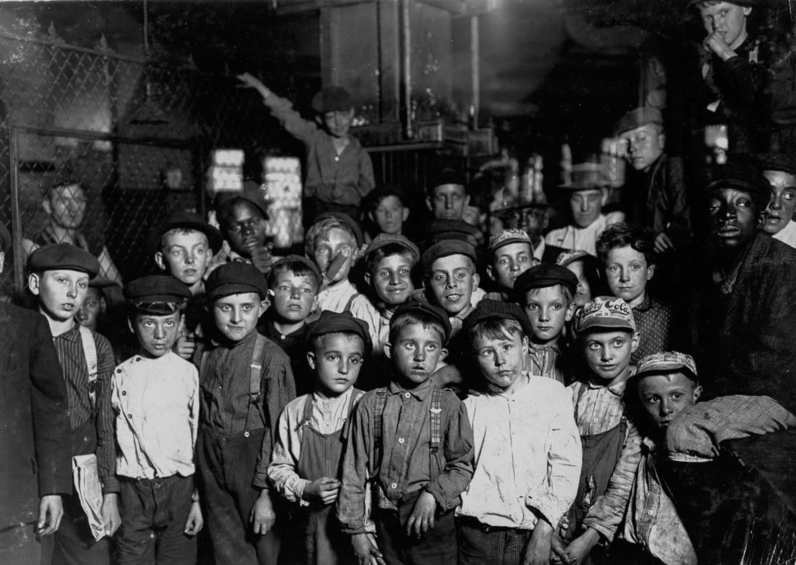 Newsboys waiting for the Baseball edition, in a newspaper office. Bad environment, Indianapolis, Indiana, 1908.