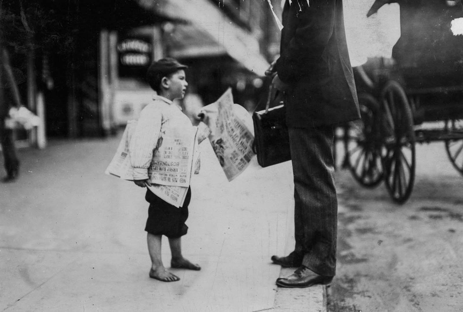 Hyman, six year old newsie. Another six year old newsie said he sold until 6 p.m. Lawrence, Massachusetts, 1911.