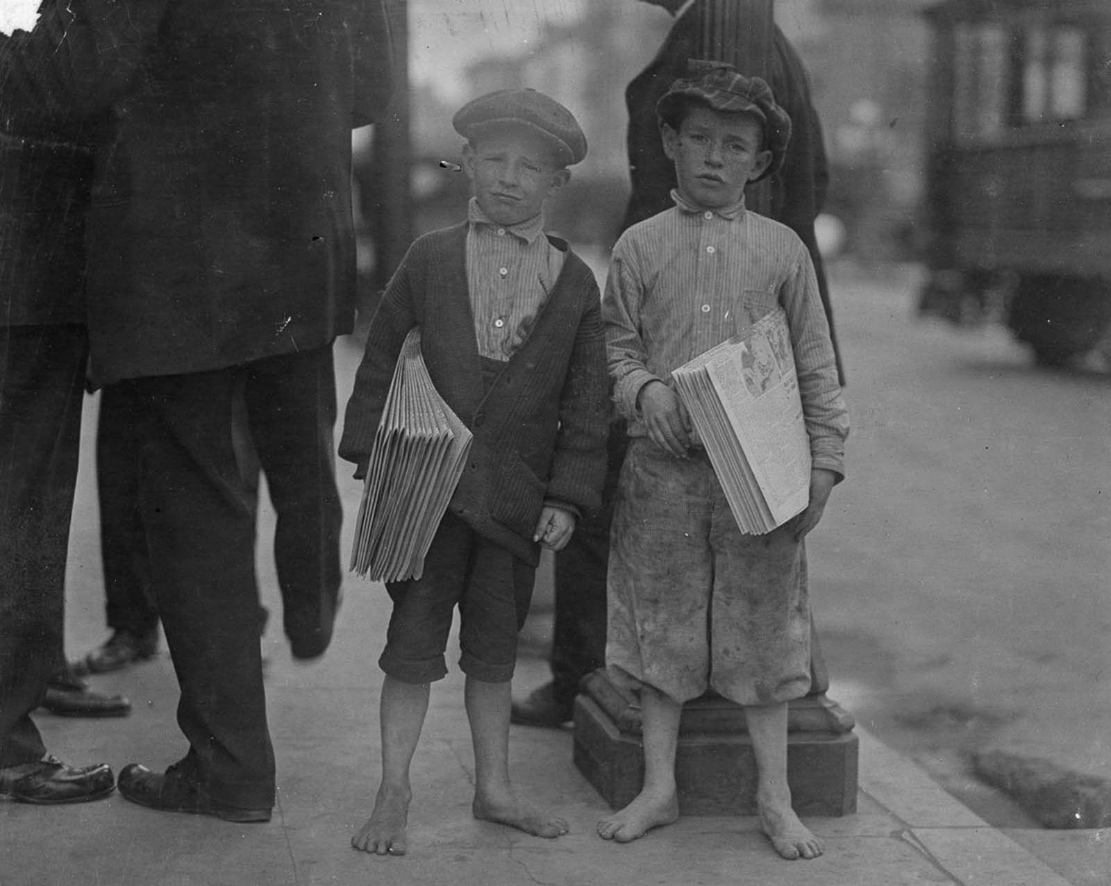 Nine-year-old newsie and his seven-year-old brother Red. Tough specimen of Los Angeles newsboys. Los Angeles, California, 1915.