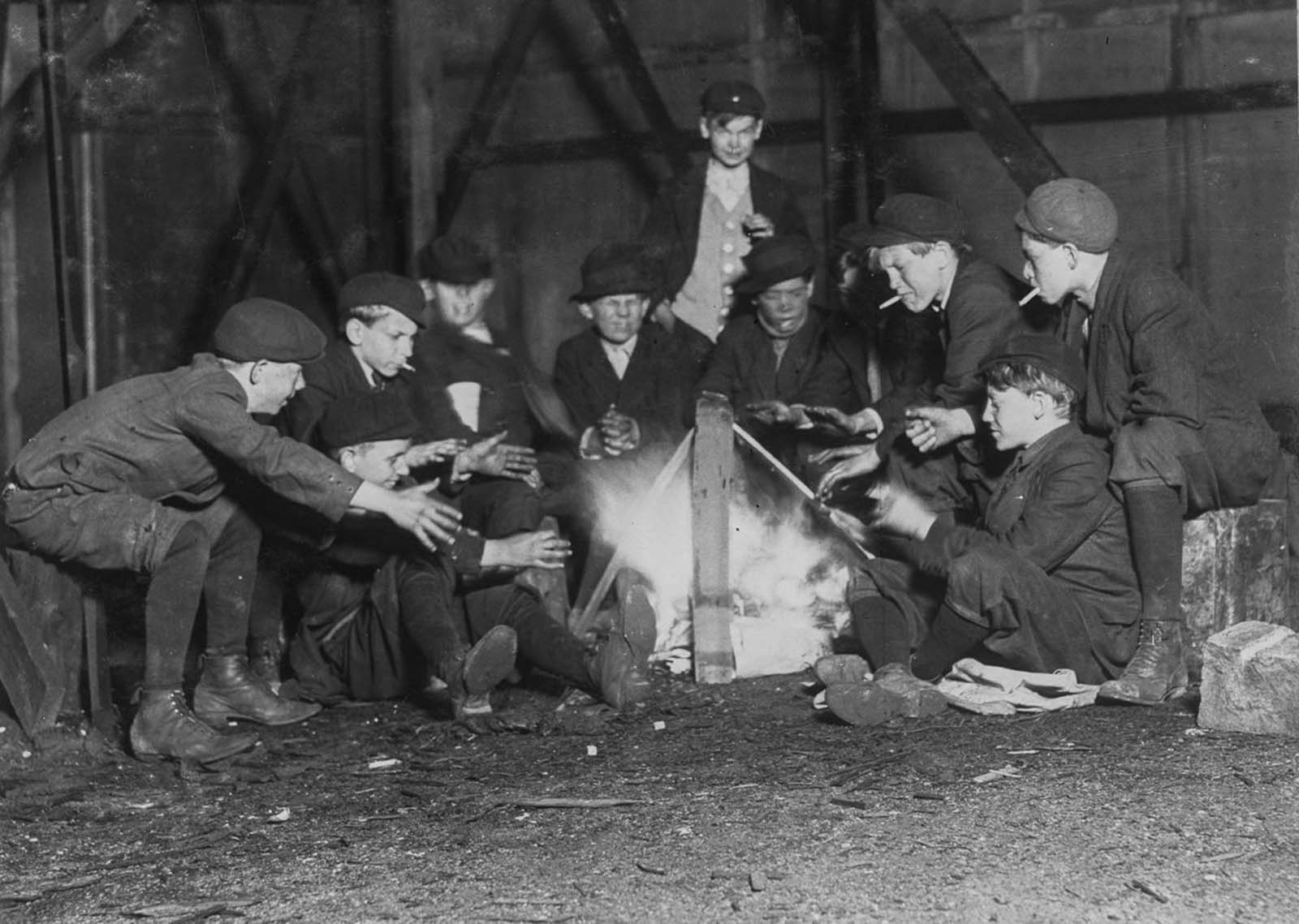 Jefferson Street Gang of newsboys 10 p.m. over campfire in corner lot behind billboard.