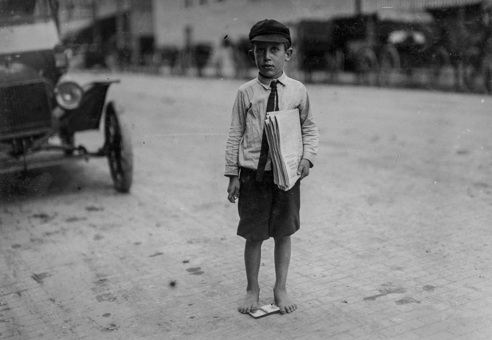 Eight-year-old newsie. Many youngsters get up early to sell papers. One 10-year-old starts out at 3 a.m. every day and goes to school. Waco, Texas, 1913.