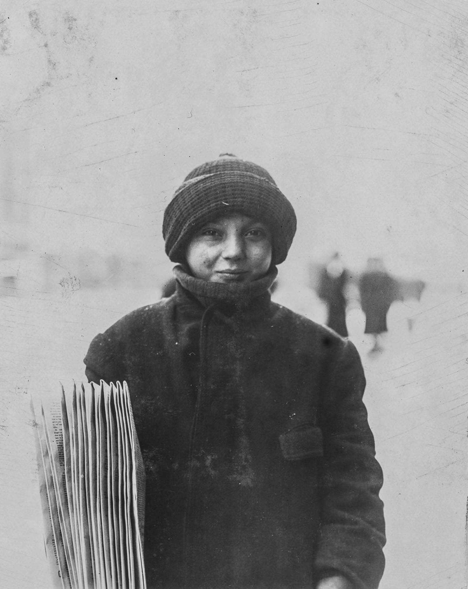 Newsie, selling before school, 7 a.m. Quito Scentola, 13-years-old, 20 Pennsylvania Avenue, been selling papers four years. Rochester, New York, 1910.