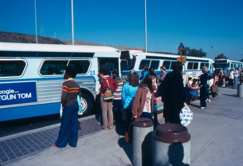 Passengers board San Diego Transit buses at the Fashion Valley Transit Center in January 1977