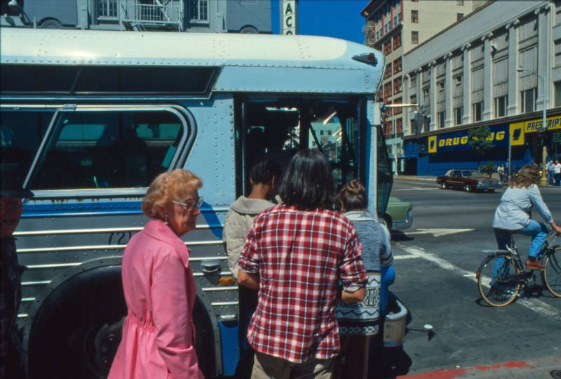 A 1974 Flxible bus picks up passengers on Broadway at 4th Avenue (Horton Plaza)