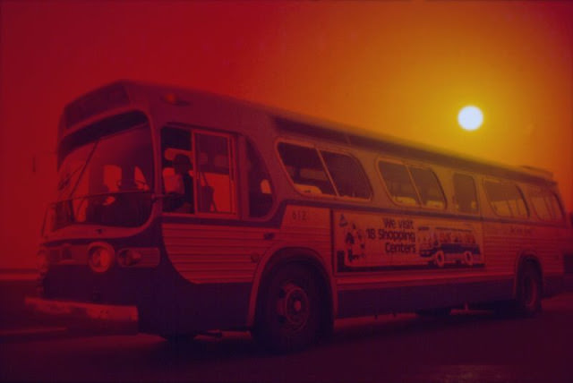 GMC bus at sunset