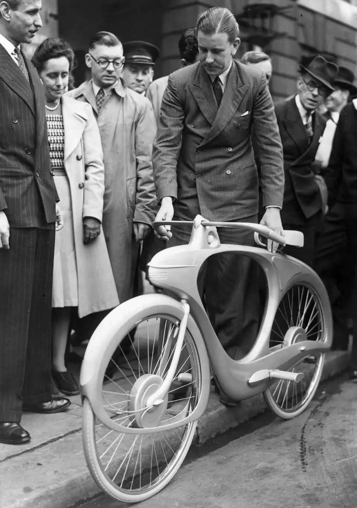 Bowden showing off his bicycle on September 17, 1946