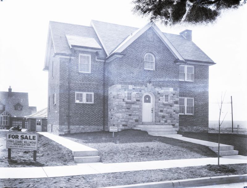 Model house, probably in St. Louis Hills, built by the Cyrus Crane Willmore Organization. Signs in the front yard advertise that the house is for sale, February 1931