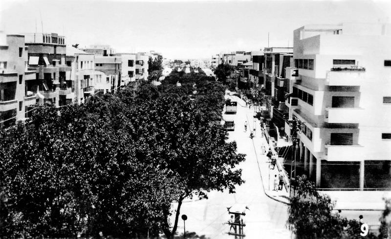 Looking east along Boulevard Rothschild (now Rothschild Boulevard) near the intersection with Herzl Street, Tel-Aviv, Palestine (now Israel), 1937