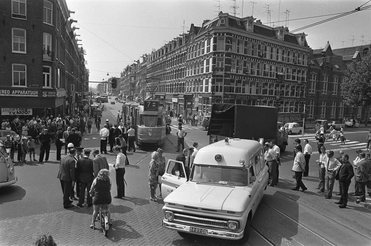 Collision of tram Nassaukade corner Kinkerstraat with ESA bus. Overview with ambulance. August 4, 1970