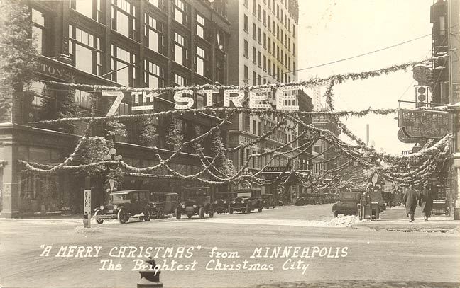 Christmas decorations at 7th Street and Nicollet Avenue. Dayton department store on left, 1930s