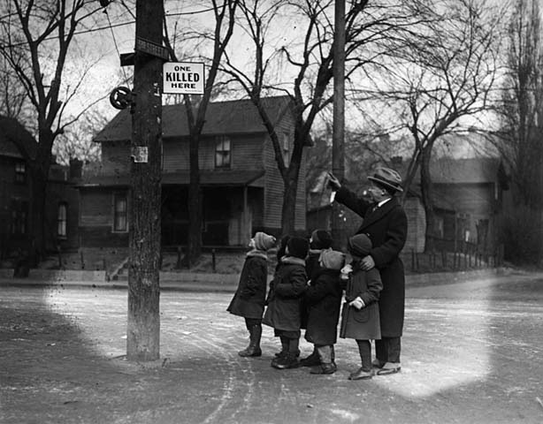 Minneapolis Mayor George E. Leach points out a good place to get run down by a car, Minneapolis, Minnesota, 1930s