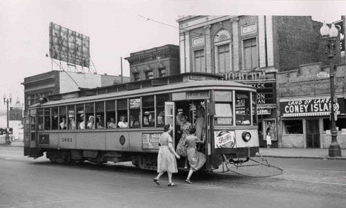 Passengers boarding a street car at Hennepin and 9th, Minneapolis, 1930s
