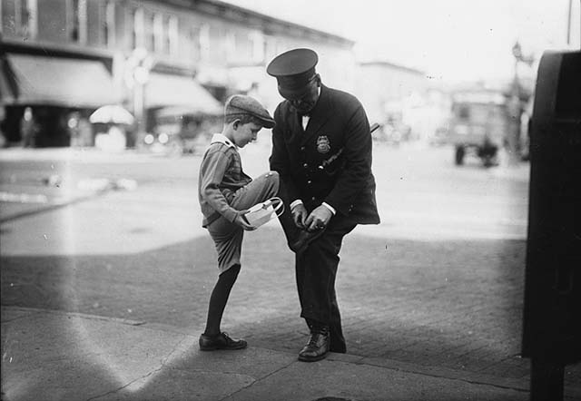 Policeman with boy at Thirty-Sixth Street and Nicollet Avenue, Minneapolis, Minnesota, 1930s