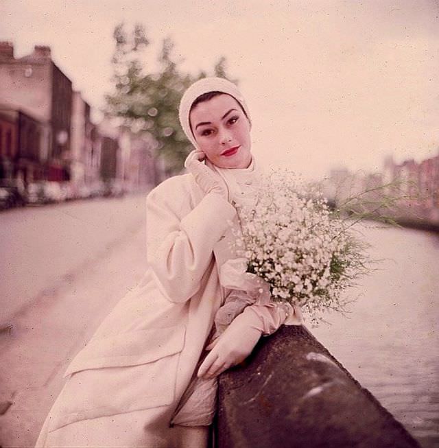 Anne Gunning in 'Bainin' tweed coat with large lapels and pockets by Sybil Connolly, Dublin, Ireland, 1953.