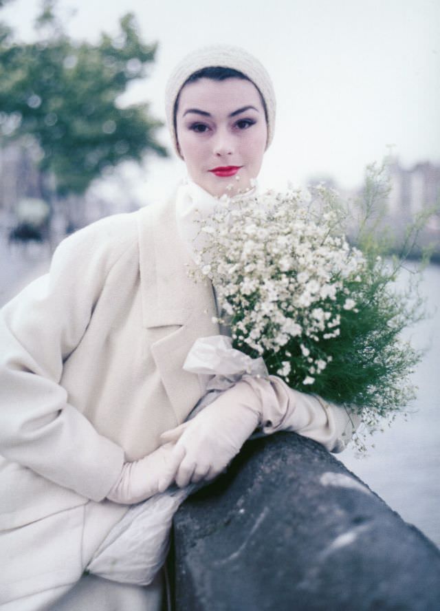 Anne Gunning in 'Bainin' tweed coat with large lapels and pockets by Sybil Connolly, photo by Milton Greene on Wellington Quay in Dublin, Ireland, 1953