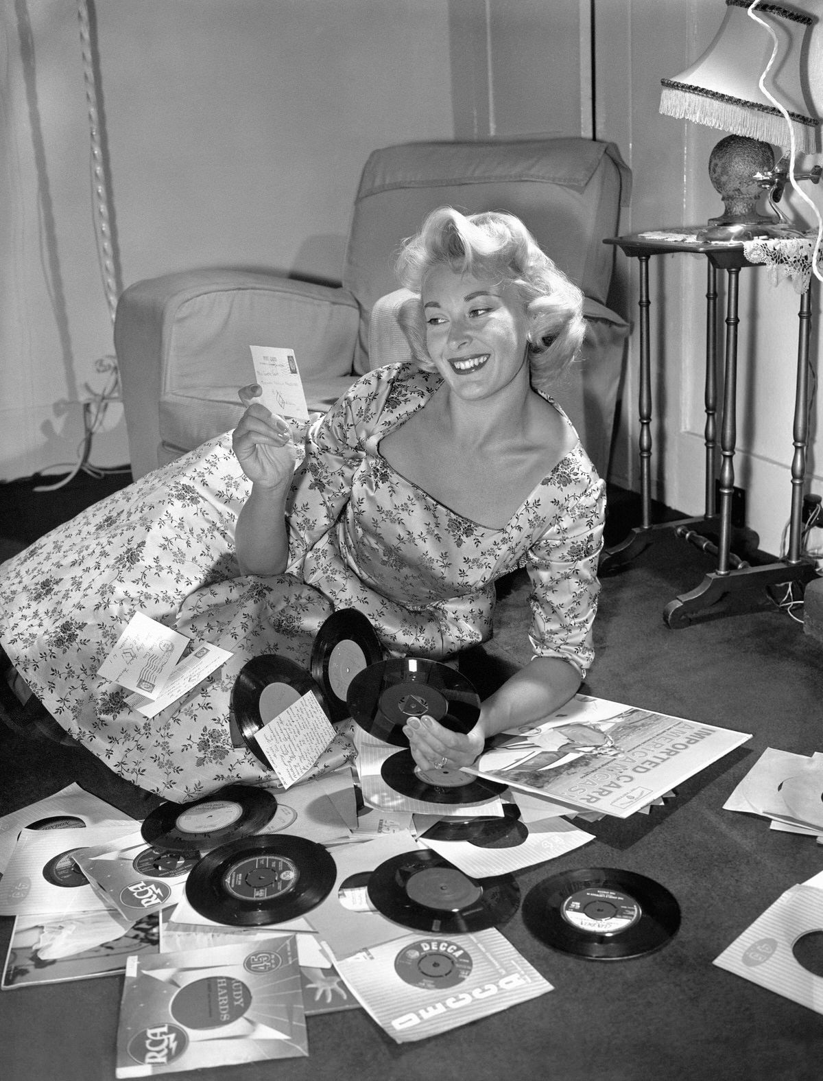 Singer Carole Carr takes over as disc jockey on the radio programme linking Britons with their relatives and friends in the forces overseas, 1959
