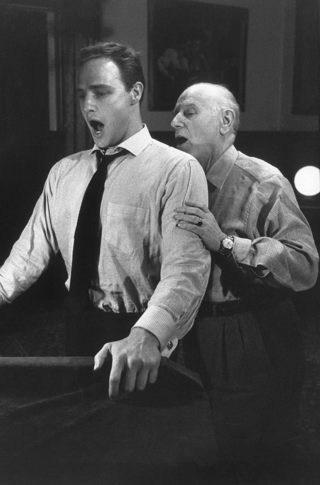 Marlon Brando practices with his singing coach for his role in "Guys and Dolls," Goldwyn Studios, 1955