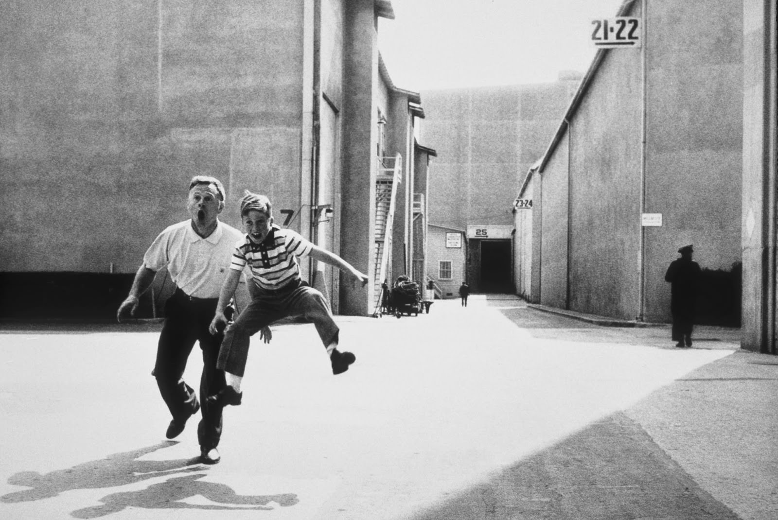 Mickey Rooney and his son Teddy jumping for joy on the MGM lot in Culver City, 1958