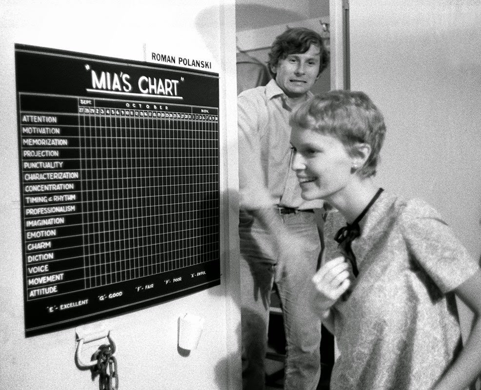 Roman Polanski with Mia Farrow as she discovers her chart on the Paramount set of "Rosemary's Baby," 1967