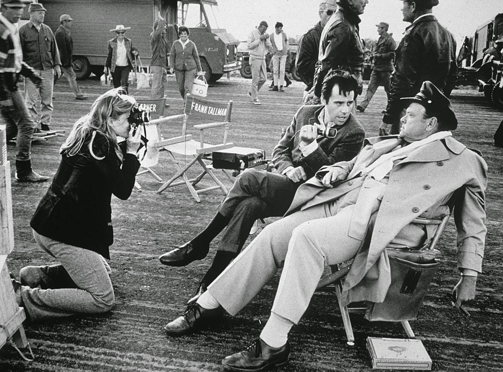 Candice Bergen visits the "Catch-22" set in Mexico, photographing Peter Bogdanovich as he interviews cast member Orson Wells; 1969