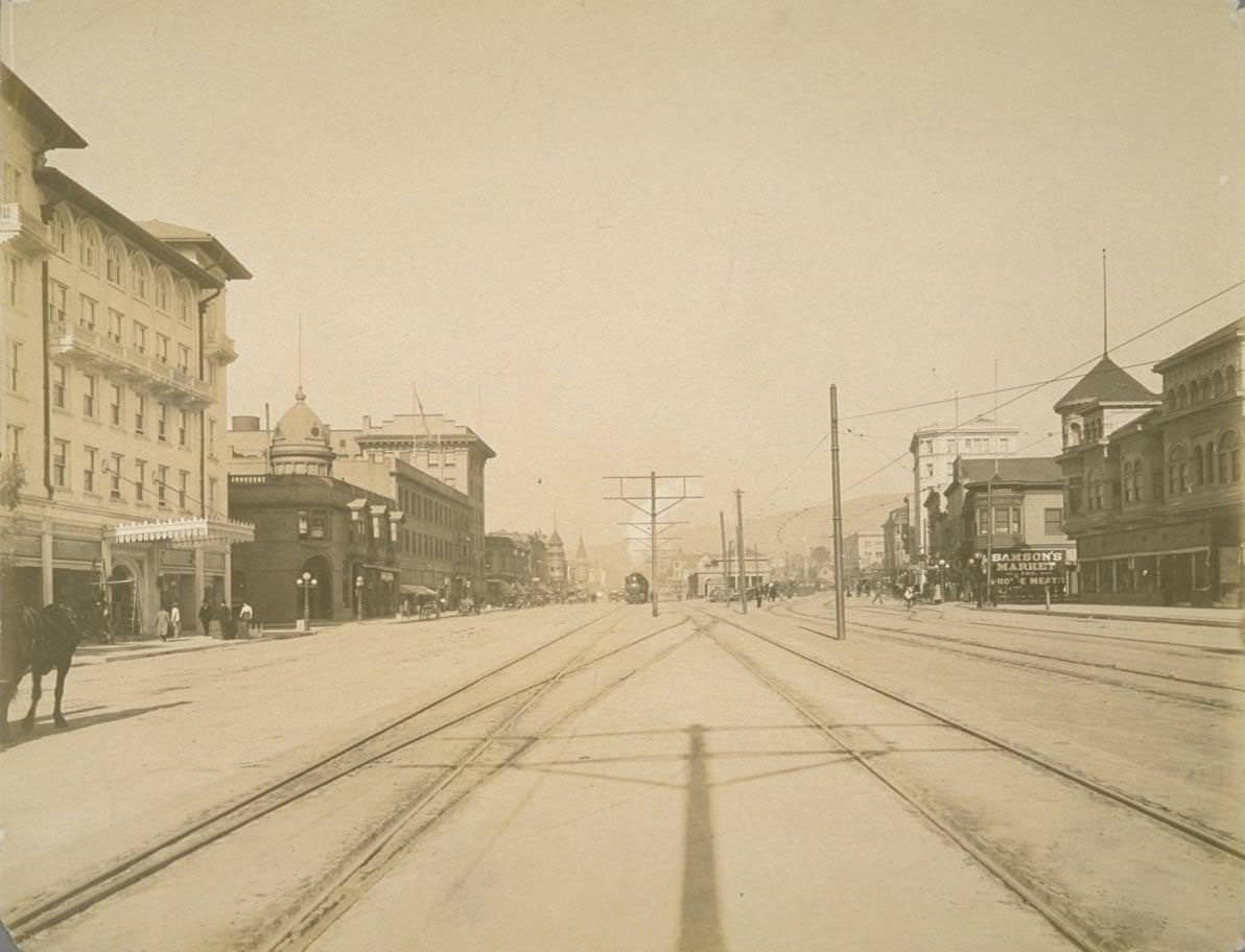 Street scene, with horse buggies, electric trolley car, 1922.