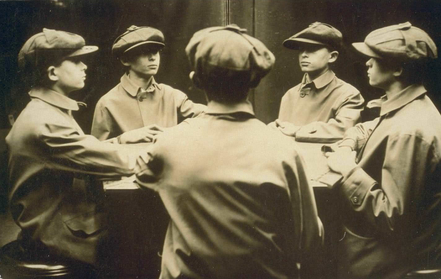 A boy posing in mirrored corner, 1920s