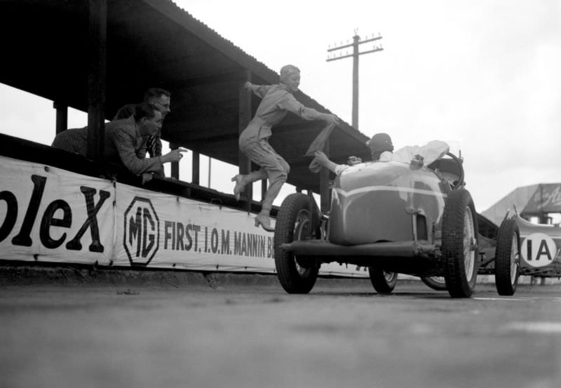 Doreen Evans taking over the sash during a relay race at Brooklands, July 1935.
