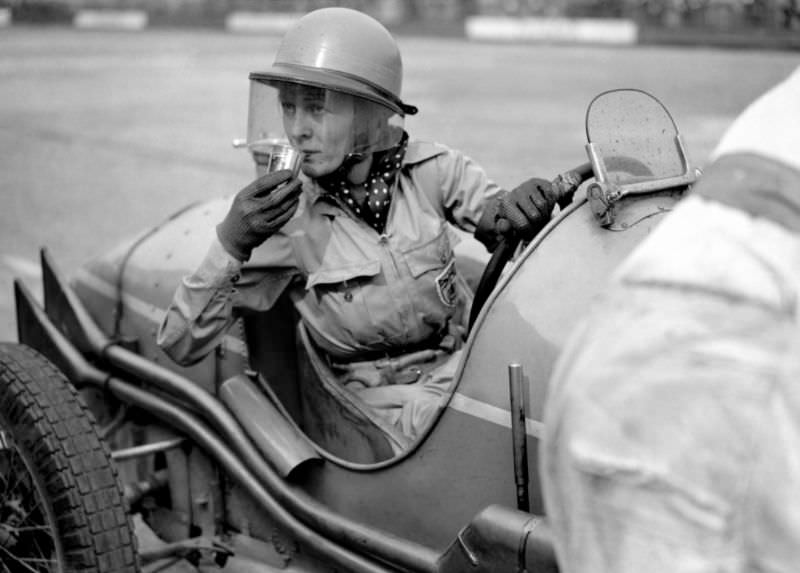 Doreen Evans taking a refreshment, July 1936.