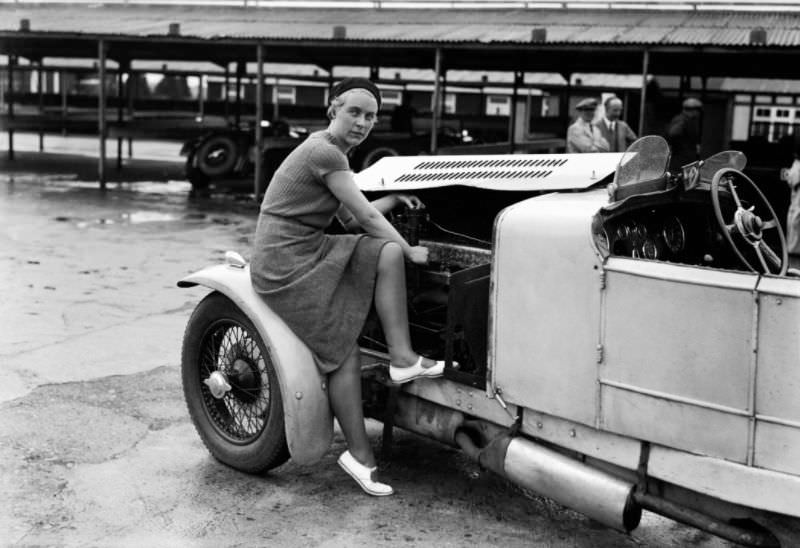 Kitty Brunell tunes up her AC Ace Sports engine, 1932.