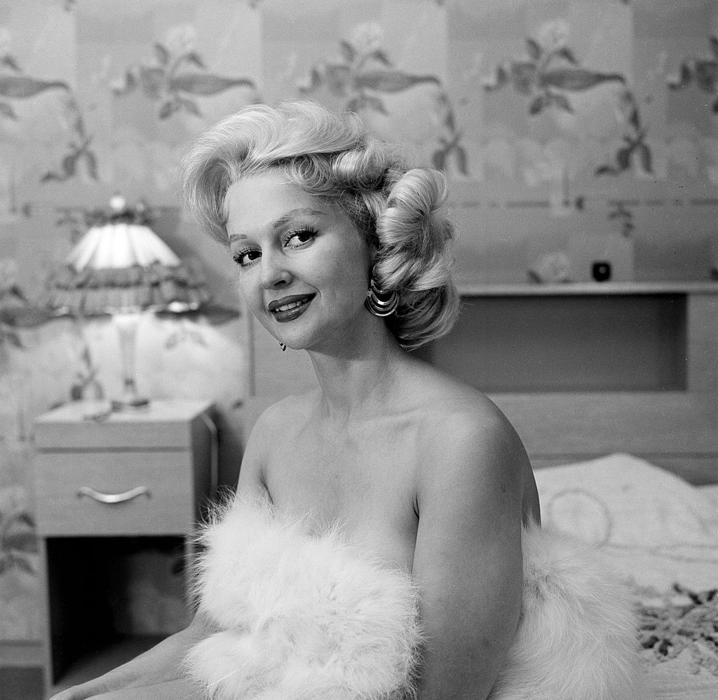 Greta Thyssen posing on the bed, 1956.