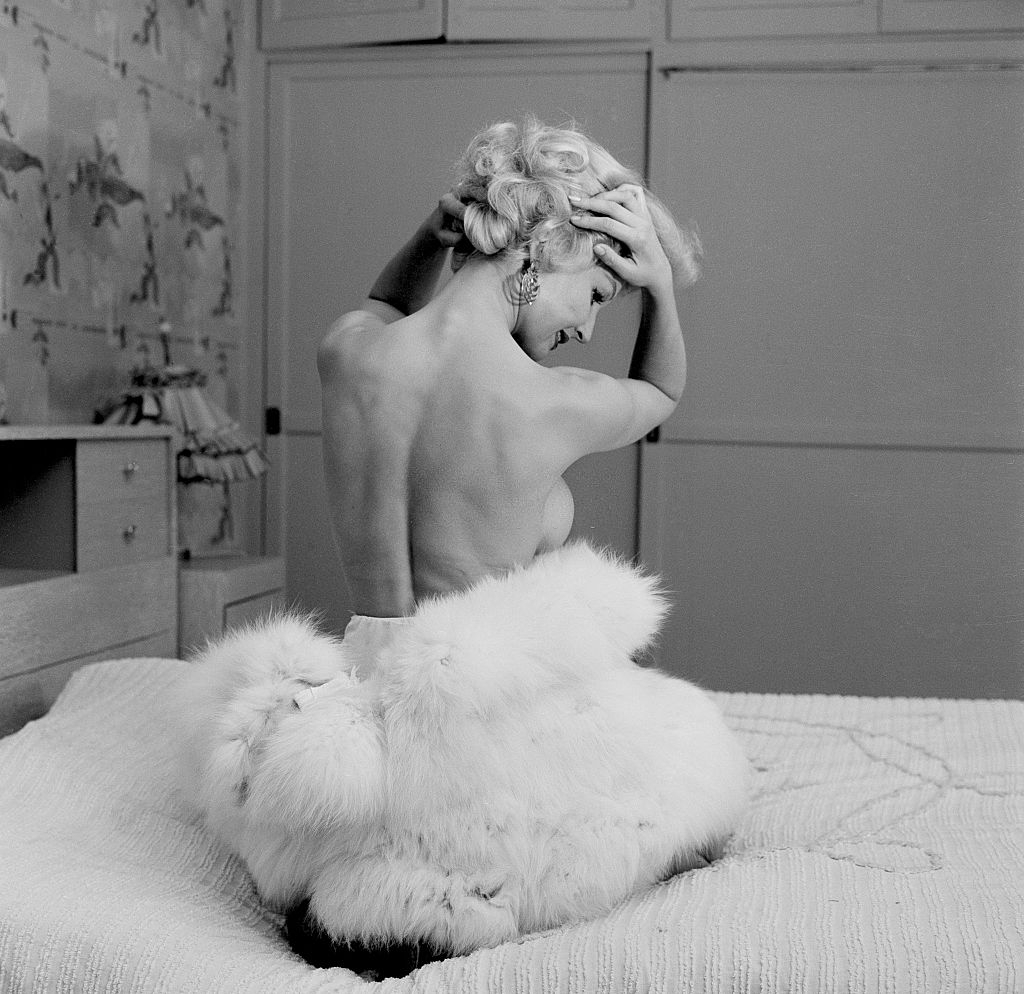 Greta Thyssen posing on the bed, 1956.