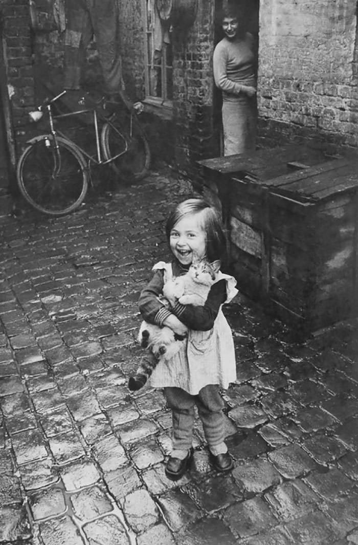 Happy french girl and her cat, 1959