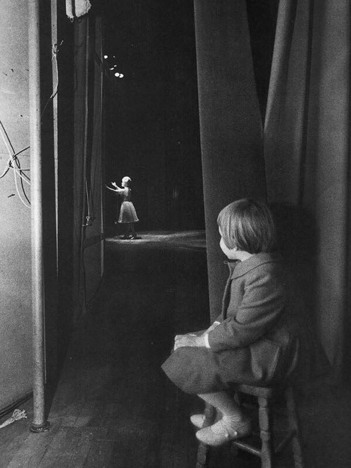 Young carrie fisher watching her mother debbie reynolds perform on stage, 1963