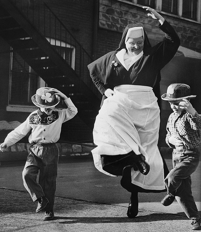 Nun dancing with children, 1964