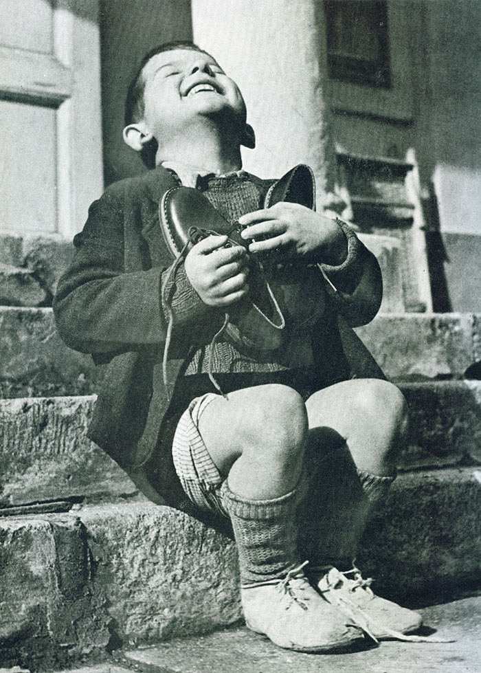 Austrian boy receives new shoes during wwii